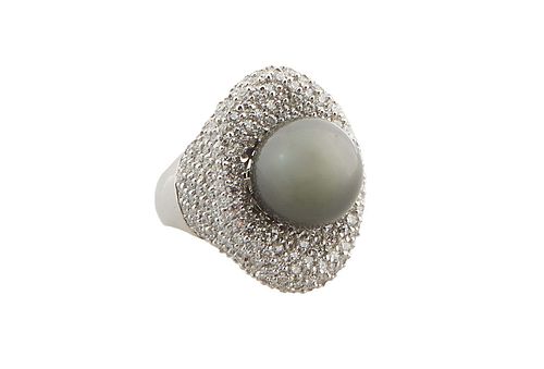 Lady's 14K White Gold Dinner Ring, with a 12 mm black Tahitian pearl atop a surface and shoulder mounted with round diamonds, total diamond wt.- 2.82 