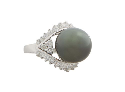 Lady's 14K White Gold Dinner Ring, with a 15mm black Tahitian cultured pearl set within a round diamond mounted border and diamond mounted lugs, total