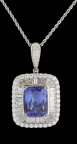 Platinum Pendant, with a 13.87 carat cushion cut tanzanite atop a border of baguette diamonds, within an outer border of round diamonds, suspended fro