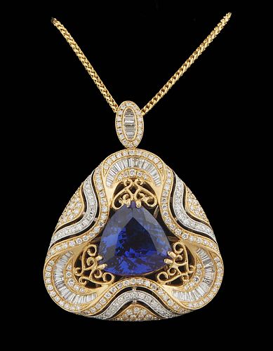 14K Yellow and White Gold Pendant, of triangular form with a central 10.33 carat trillion cut tanzanite, within pierced borders mounted with baguette 