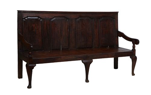 English Carved Oak Settle, 19th c., the stepped crown over a fielded panel back, to a seat flanked by curved scrolled arms, on Queen Anne legs with pa