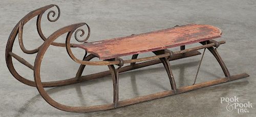 Child's painted wood sled, 19th c., with remains of original red paint and scrolled runners, 42'' l.