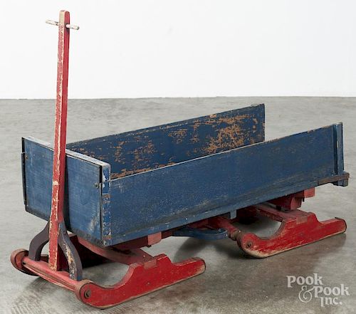 Child's painted pine pull box sled, ca. 1900, retaining an old red and blue surface, 37'' l.