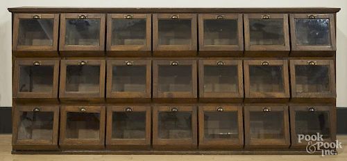 Oak country store seed counter, ca. 1900, with twenty-one drawers and glass panes, 54'' h., 120'' w.