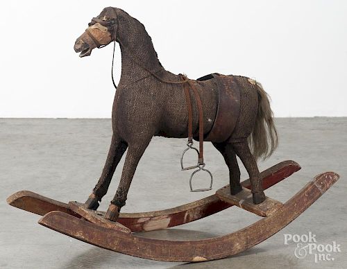 Fabric covered child's rocking horse, 19th c., 24'' h., 33'' l. Provenance: Barbara Hood