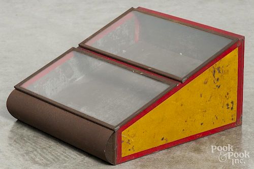 Painted tin counter top display case, ca. 1900, with two lift top compartments, 7'' h., 12 1/2'' w.