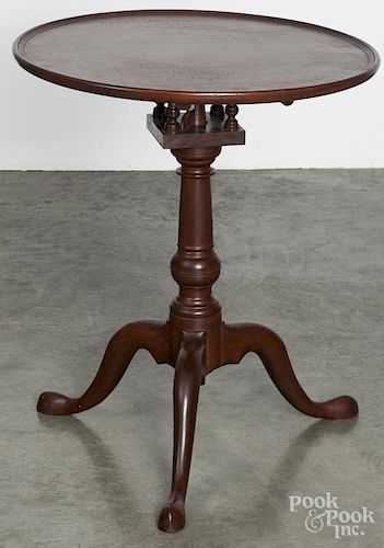 Centennial Chippendale style walnut tea table with a dish top and bird cage support, 26'' h.