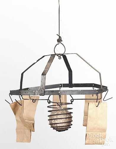 Tin hanging country store string and bag holder, 20th c., 13'' w. Provenance: Barbara Hood