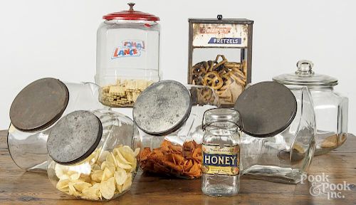 Eight colorless glass country store counter jars, 20th c., to include Reisman Pretzels, Lance