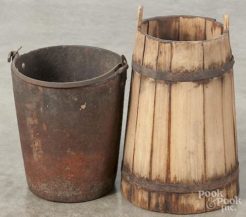 Pine water bucket, 19th c., 14'' h., together with a fiber fire bucket, 10'' h.