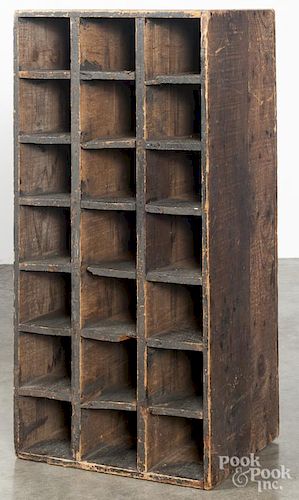Primitive painted pine cubby hole cupboard, ca. 1900, retaining an old black surface, 34 1/2'' h.