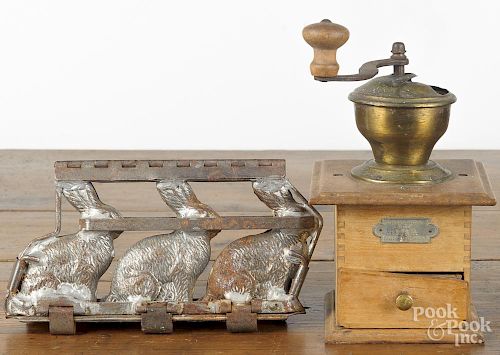 German coffee mill, early 20th c., 10 1/2'' h., together with a German rabbit candy mold, 10'' w.