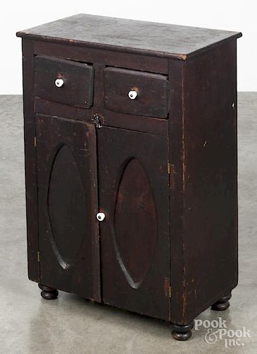 Child's stained pine jelly cupboard, 19th c., with sunken over paneled doors under two drawers