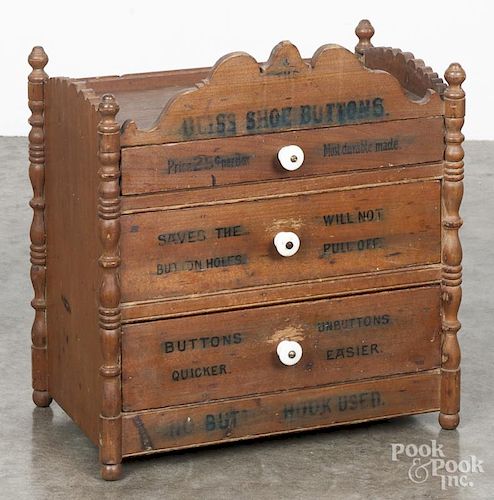 Bliss Shoe Buttons pine country store counter top, ca. 1900, with a drawered cabinet, 18'' h.