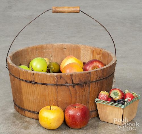Wooden bail handle bucket, ca. 1900, with a collection of plastic fruit, 6 3/4'' h., 14'' dia.