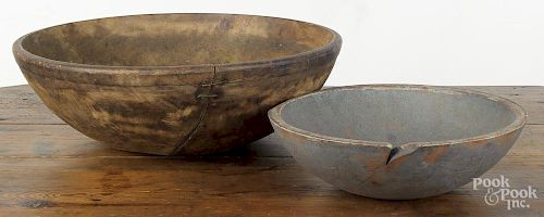 Large turned wooden bowl, 19th c., 7'' h., 21 1/2'' dia., together with another with later blue paint