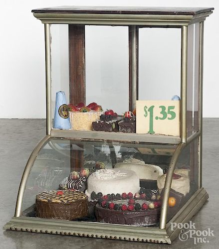 Country store nickel-plated counter top showcase, ca. 1900, filled with faux cakes and pies, 29'' h.