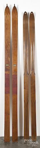 Two pairs of Northwood wooden skis, ca. 1900, with nice stag decal labels, 72'' l. and 77'' l.