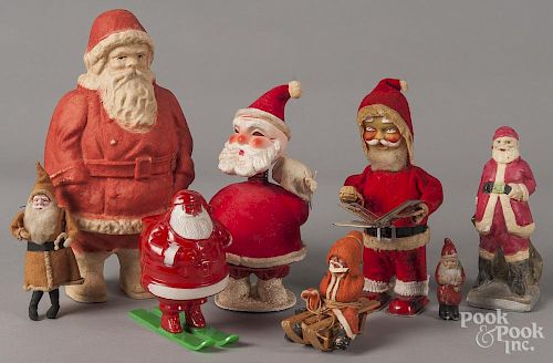 Santa Claus figures, 20th c., to include a Japanese wind-up with a book