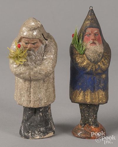 Two German composition Santa belsnickles, one in a mica covered white robe, 6'' h.