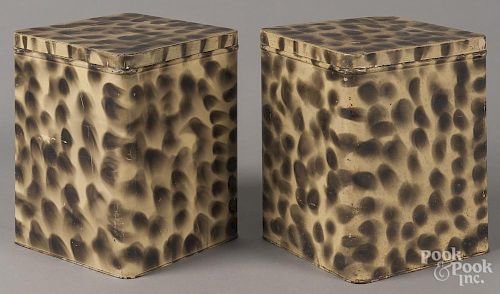 Pair of smoke decorated tin canisters, early 20th c., with later decoration, 9'' h.