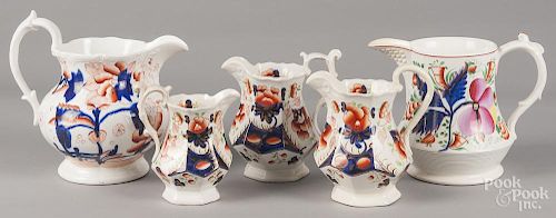 Two Gaudy Welsh pitchers and a creamer in the Cambrian Rose pattern, together with two pitchers