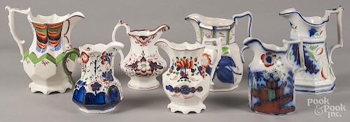 Seven Gaudy Welsh pitchers and creamers, patterns to include Sunflower, Hydrangea, Centerpiece