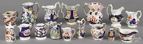 Sixteen Gaudy Welsh small pitchers and creamers, tallest - 6''.