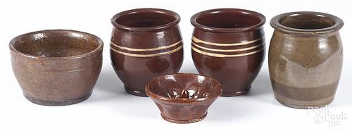 Five pieces of Pennsylvania redware, 19th c., to include three apple butter crocks