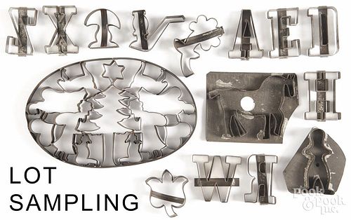 Tin cookie cutters, 19th c., including twenty-three individual letters, a horse, a pipe, etc.