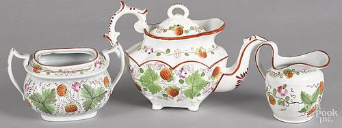 Three-piece Queens rose strawberry pearlware tea service, 19th c., to include a teapot, 7'' h.