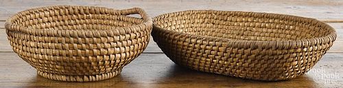 Two Pennsylvania rye straw baskets, 19th c., one with an open work handle, 14'' w. and 10'' dia.