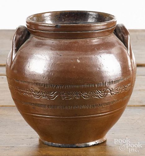 Redware bulbous crock, probably New England, 19th c., with coggle wheel decoration