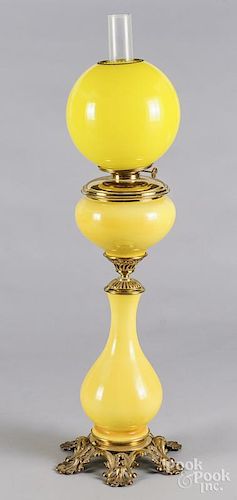 Victorian cast iron and brass yellow glass banquet lamp, late 19th c., overall - 34 3/4'' h.