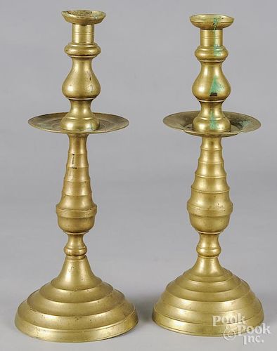 Large pair of Victorian brass candlesticks, late 19th c., with a drip pan, 19'' h.