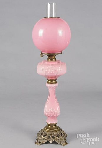 Victorian cast iron pink glass kerosene lamp, late 19th c., 27 1/2'' h.
