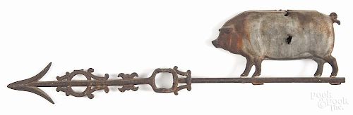 Swell-bodied tin pig weathervane, 19th c., with a cast iron directional arrow, 24 1/4'' l.