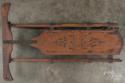Stenciled Special Coaster child's sled, early 20th c., with steel runners, 33'' l.