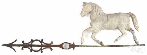 Swell-bodied tin horse weathervane, 19th c., with a cast iron directional arrow, 33'' l.