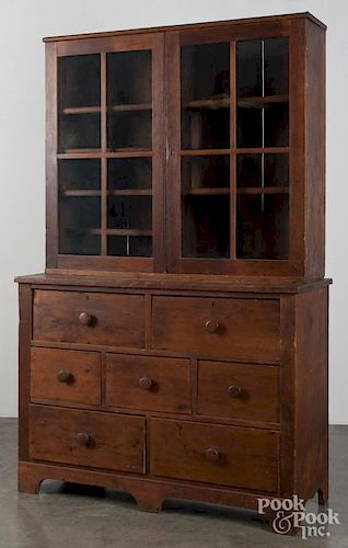 Pennsylvania pine country store stepback display cupboard, 19th c., with two doors