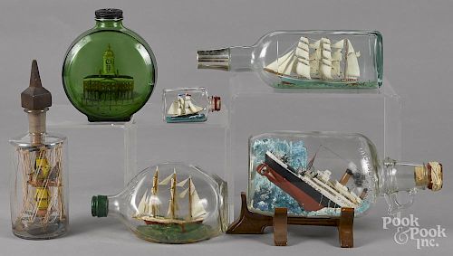 Four contemporary ships in bottles, together with a bottle with Old City Hall in Philadelphia