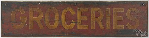 Painted pine Groceries country store trade sign, 19th c., with a mustard letter and gilt outline