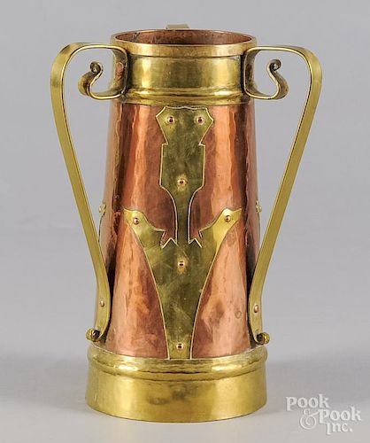 Arts and crafts copper and brass handled mug, early 20th c., 12'' h.