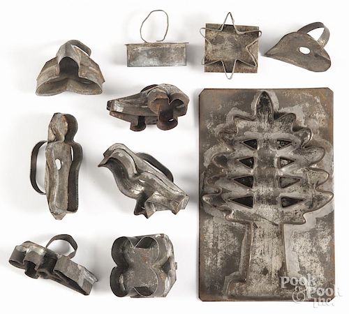Tin cookie cutters, 19th c., including one of a tree, largest - 6 1/2'' h.