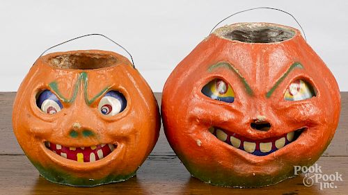 Two papier-mâché Halloween jack-o-lanterns, 20th c., with paper faces, 7'' h. and 5 1/2'' h.