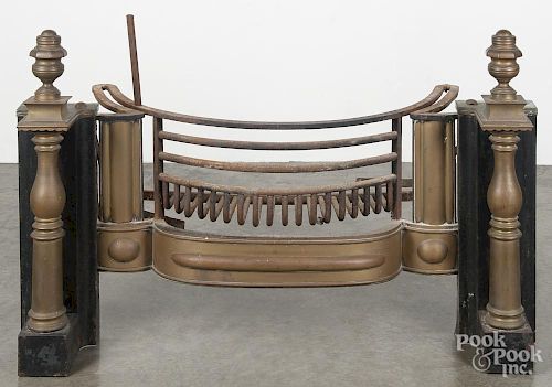 Brass and iron fireplace insert, 19th c., with attached grate and andirons, removed from a home