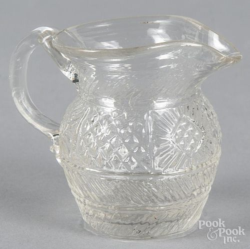 Mold blown colorless glass creamer, 19th c., 3'' h.