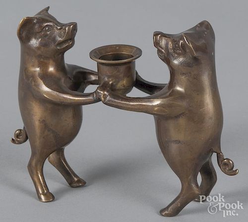 Brass figural pig candleholder, 20th c., 5'' h.