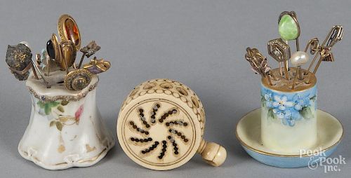 Stick pins, 19th/20th c., together with four brooches, a locket, and a carved bone baby rattle.