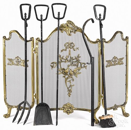 Cast brass fireplace screen, 20th c., 30 1/2'' h., 39'' w., together with iron fireplace tools.